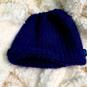 Navy blue ponytail hat with side buttons for mask